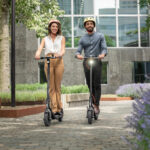 Ninebot-KickScooter-F20D-F25E-F30_Lifestyle-picture_Woman-and-man-riding-10inch-tyres